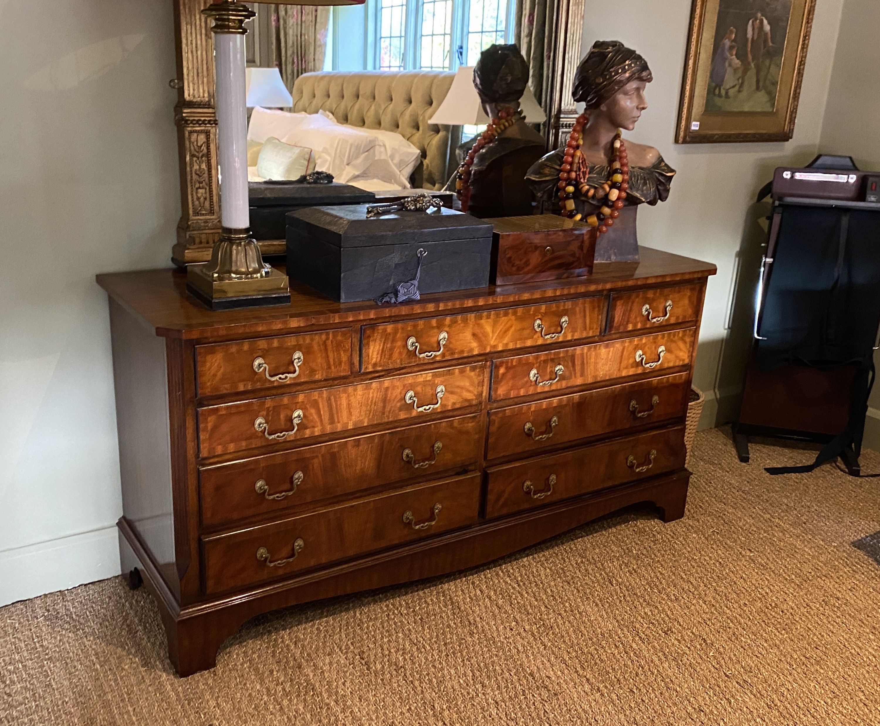 A modern Georgian style mahogany nine drawer chest, width 153cm depth 49cm height 75cm